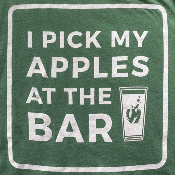 Green t-shirt with the words "I pick my apples at the bar" in the white next to a Vander Mill pint glass on the front framed in a white box