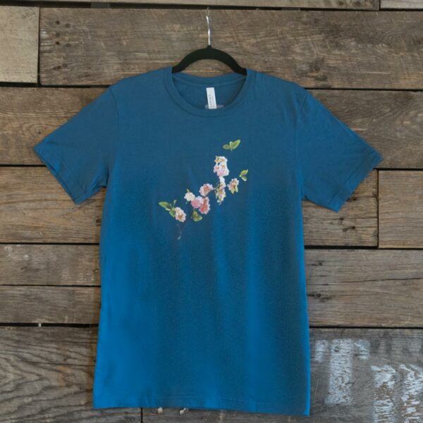 Vander Mill apple bloosom design on a teal shirt